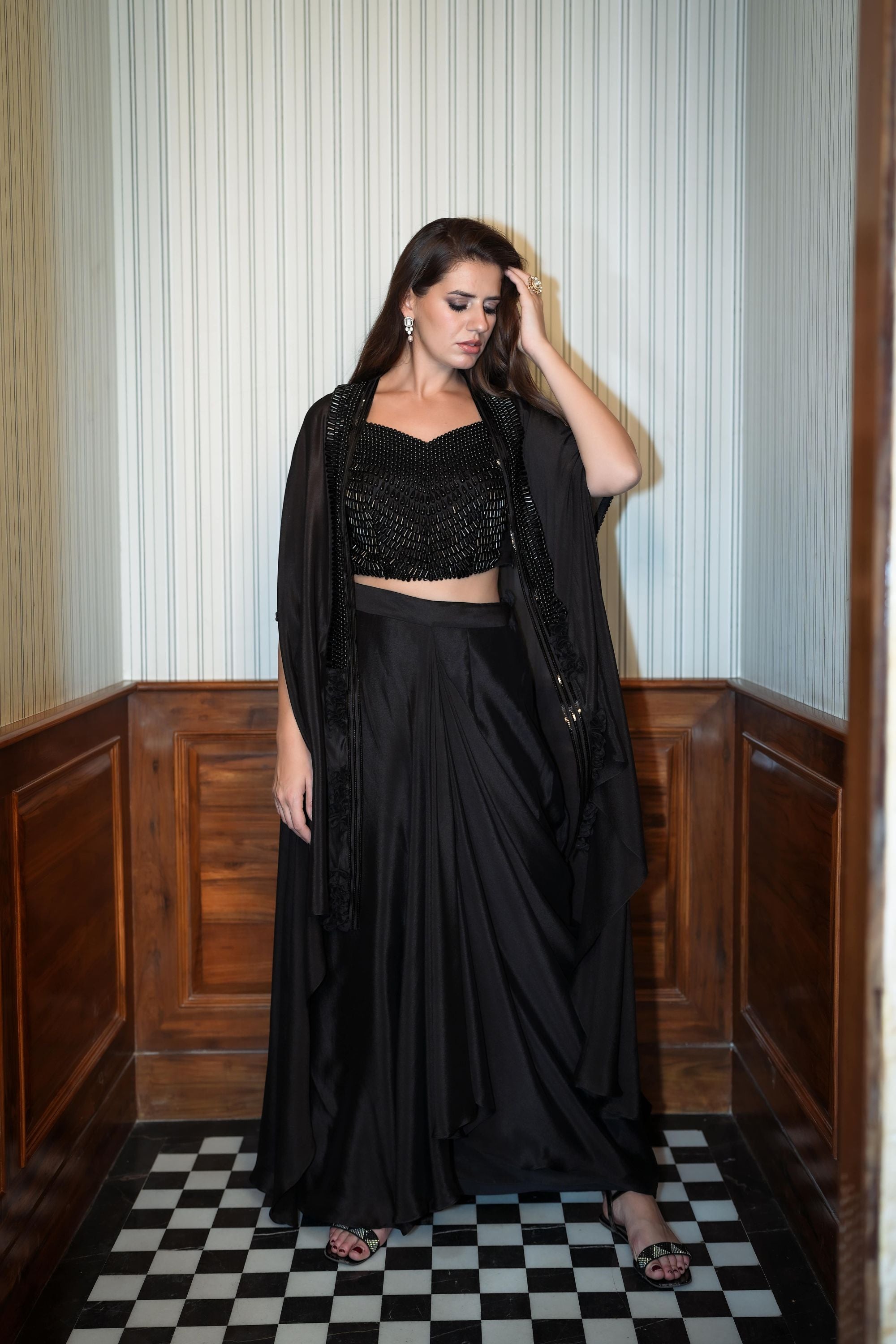 Black draped skirt with crop top and jacket set