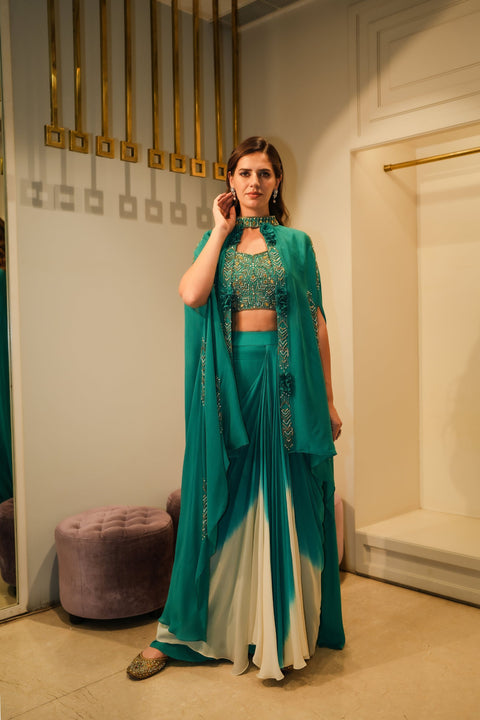 Sea green cape jacket with crop top and draped shaded skirt