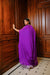 Purple cape jacket with crop top and draped shaded skirt