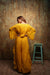 Mustard poncho style flared leg tie up jumpsuit