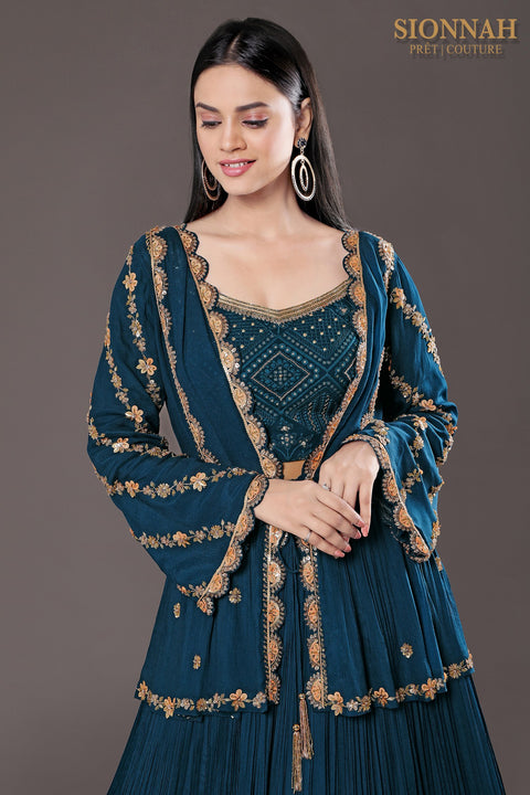 Teal blue Peplum jacket with crop top and rushed skirt.