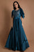 Teal blue layered draped sleeves gown.
