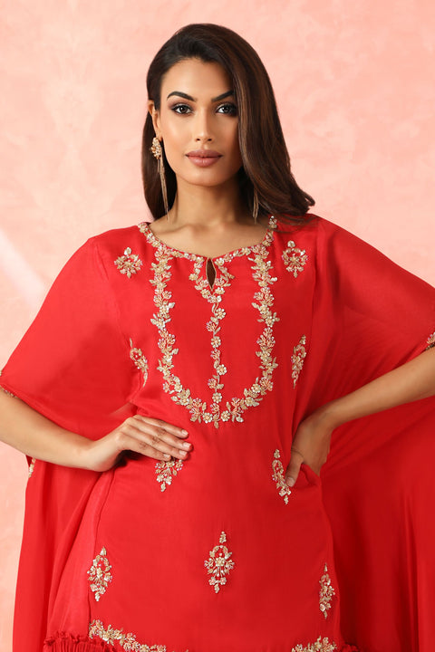 Red crepe high low tunic with gathers at the hem with gathered pallazo.