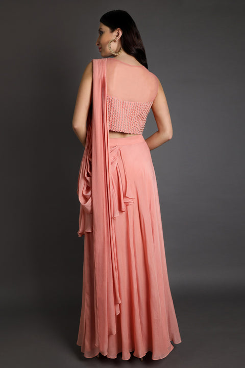 Dark peach draped crop top skirt set.