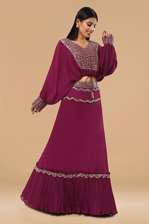 Poncho style crop top with tie up and flare rushed skirt.