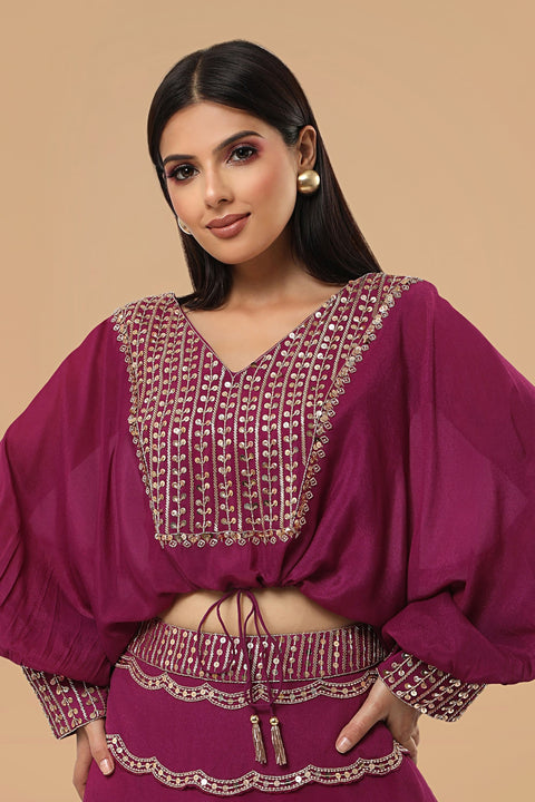 Poncho style crop top with tie up and flare rushed skirt.