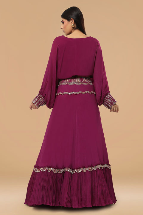 Poncho style crop top with tie up and flare rushed skirt.