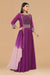 Purple gown in textured and crepe fabric.