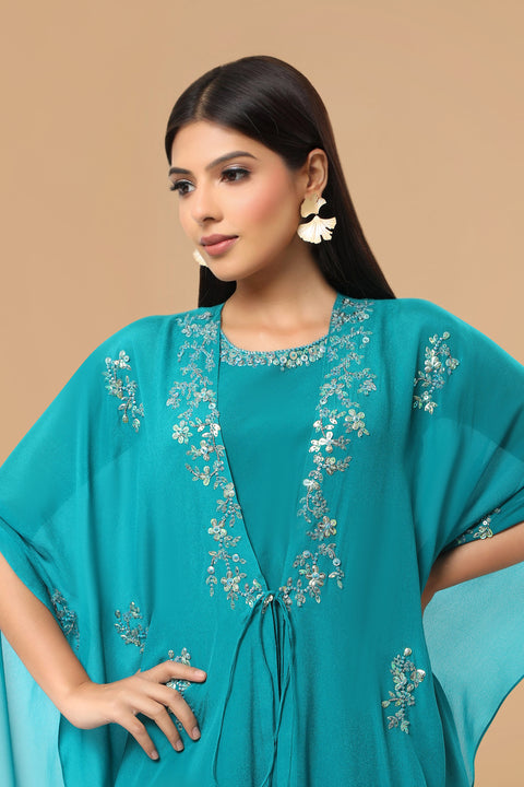 Turquoise blue tunic with handkerchief jacket and dhoti pants.