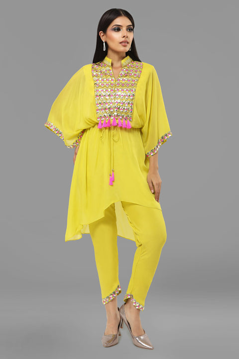 Bright yellow Poncho tunic with tie up and  tulip pants.