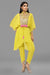 Bright yellow Poncho tunic with tie up and  tulip pants.
