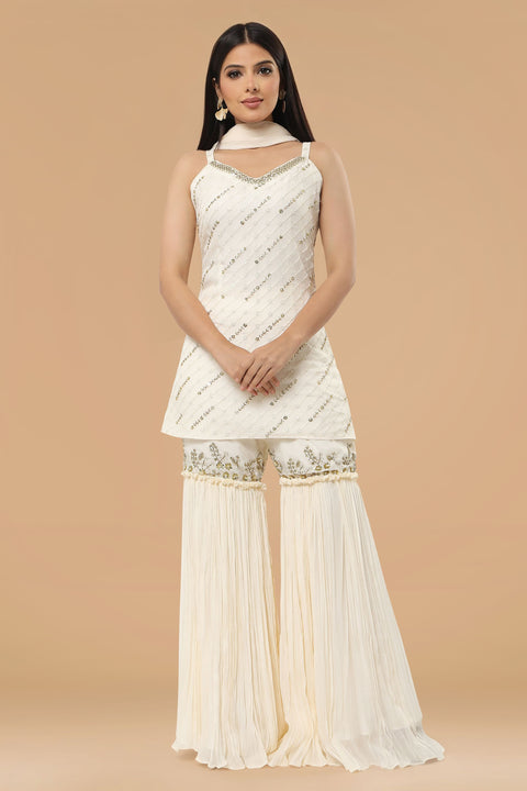 Ivory textured fabric kurta with gharara and dupatta.