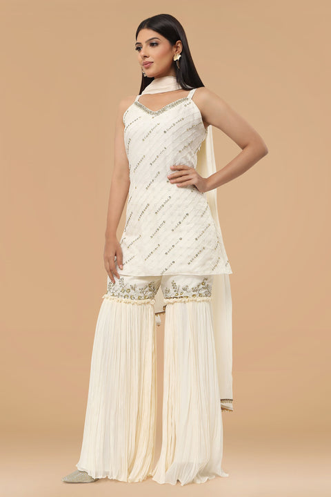Ivory textured fabric kurta with gharara and dupatta.