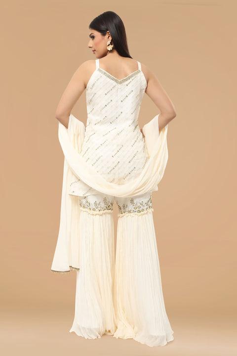Ivory textured fabric kurta with gharara and dupatta.