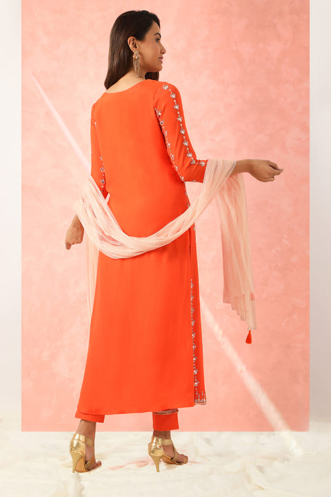 Orange embroidered tunic with matching pants and contrast dupatta.
