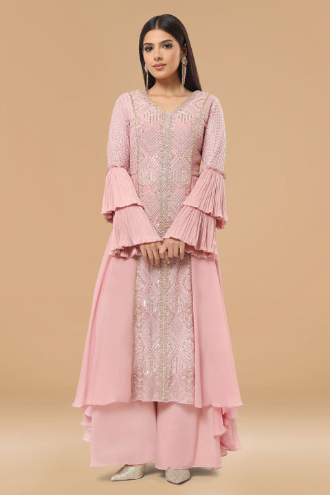 Mauve pink textured fabric and crepe flared and drape A line kurta with pallazo set.