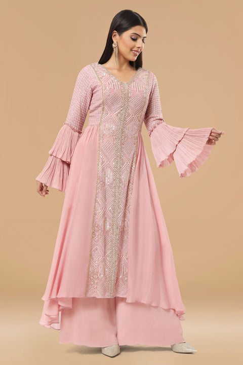 Mauve pink textured fabric and crepe flared and drape A line kurta with pallazo set.