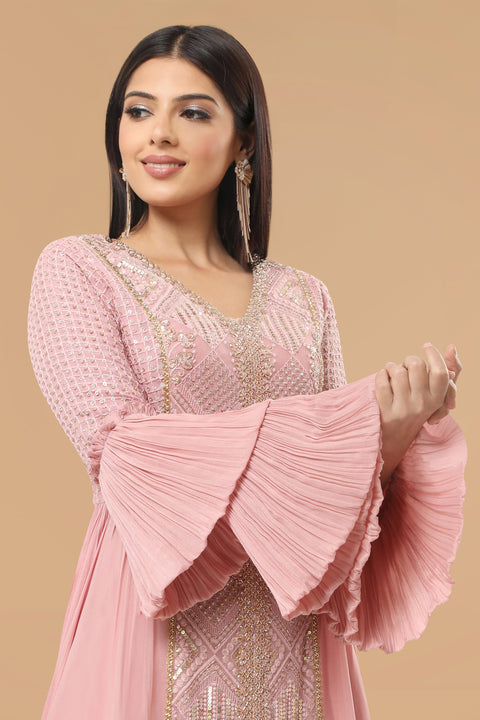 Mauve pink textured fabric and crepe flared and drape A line kurta with pallazo set.