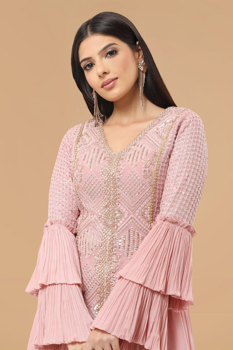 Mauve pink textured fabric and crepe flared and drape A line kurta with pallazo set.