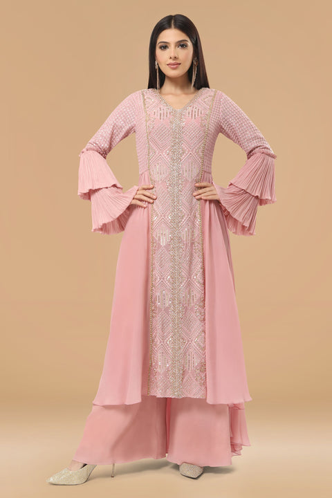 Mauve pink textured fabric and crepe flared and drape A line kurta with pallazo set.