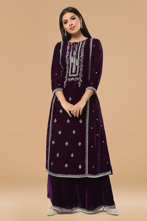 Purple A line velvet kurta with matching pallazo and contrast dupatta.