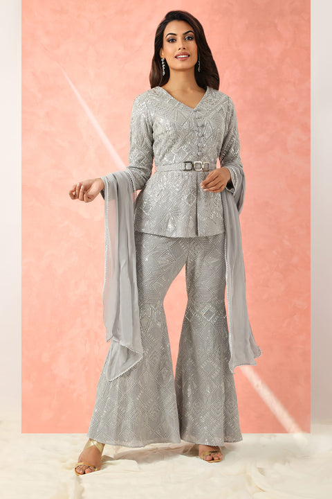 Grey textured fabric highlighted peplum top, flared pants and dupatta.