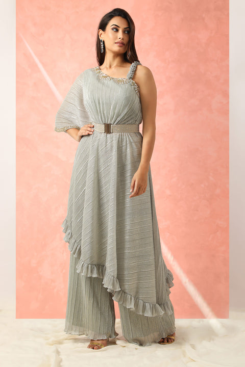 Grey shimmer one shoulder tunic with ruffles paired with pallazo and belt.