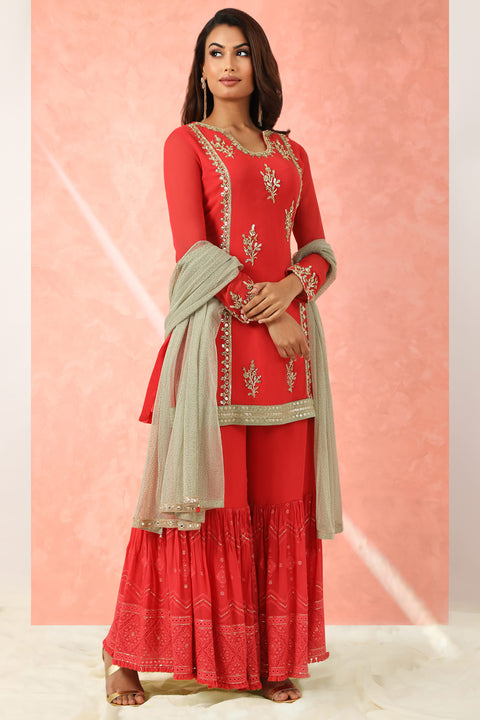 Red georgette kurta with gharara and gold dupatta.