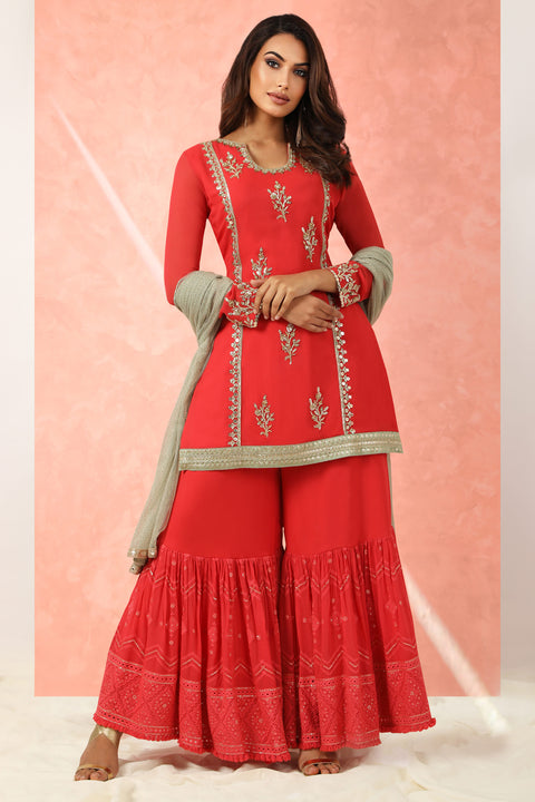 Red georgette kurta with gharara and gold dupatta.