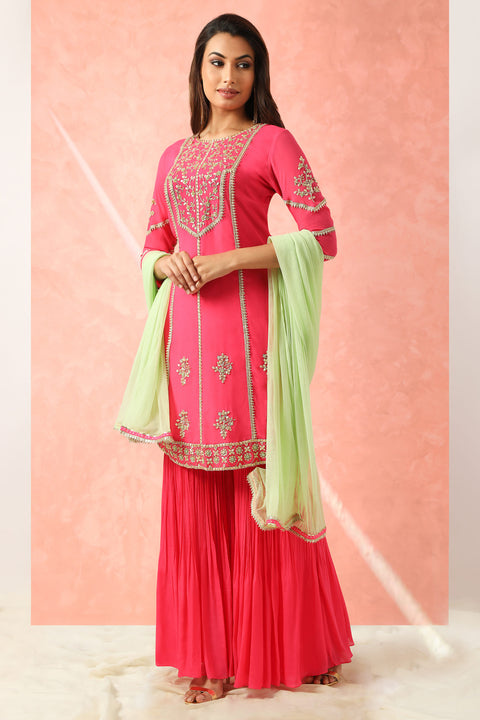 Fuchsia pink kurta with gharara and mint dupatta.