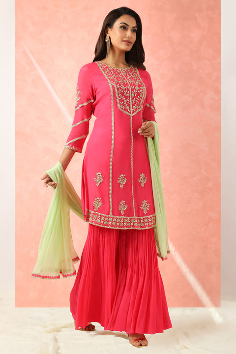 Fuchsia pink kurta with gharara and mint dupatta.