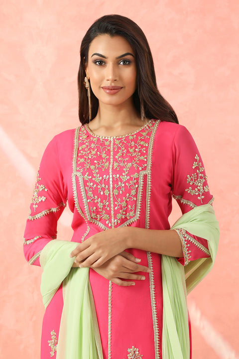 Fuchsia pink kurta with gharara and mint dupatta.