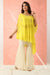 Bright yellow cold shoulder tunic paired with gharara.