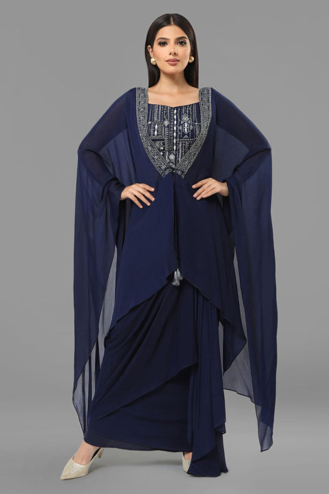 Navy blue draped skirt with matching crop top and jacket set in crepe fabric.
