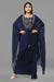 Navy blue draped skirt with matching crop top and jacket set in crepe fabric.