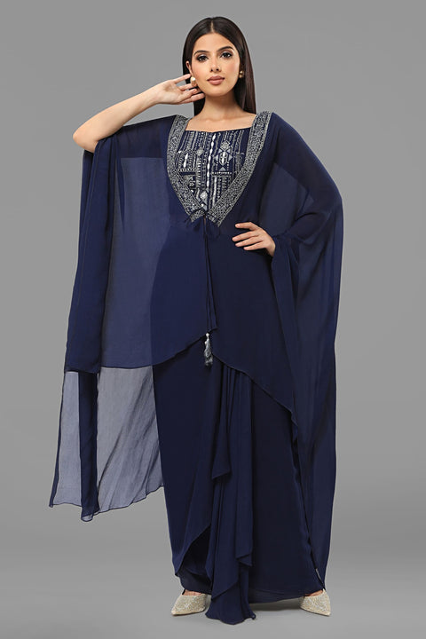 Navy blue draped skirt with matching crop top and jacket set in crepe fabric.