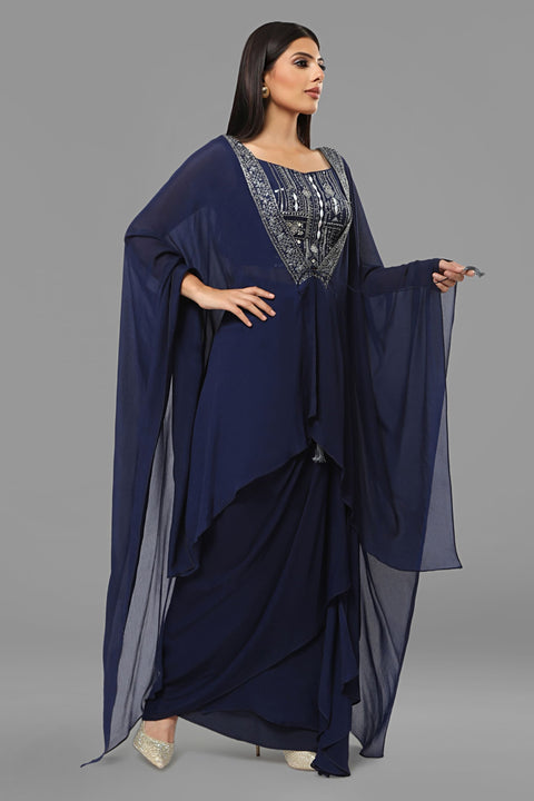 Navy blue draped skirt with matching crop top and jacket set in crepe fabric.