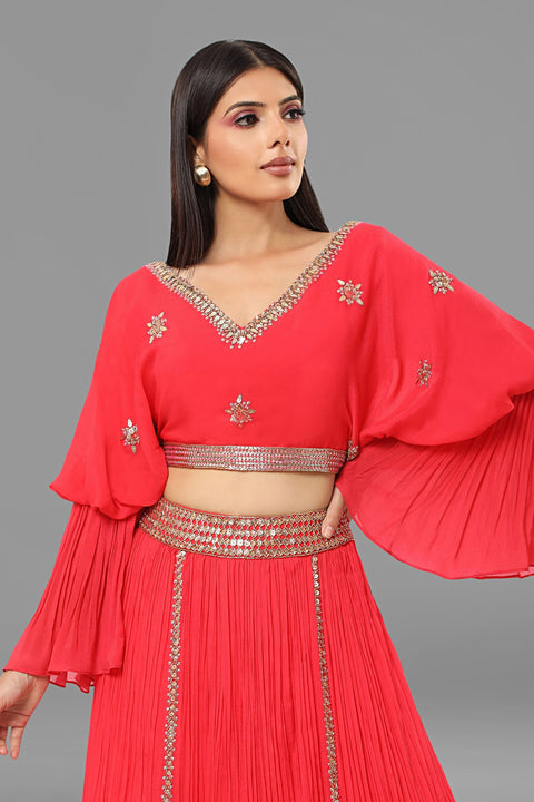 Red designer sleeves crop top with gathered skirt in crepe fabric.