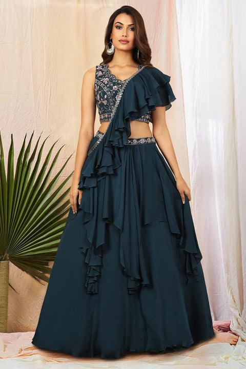 Teal blue crepe double layered skirt with matching crop top and circular ruffle drape.