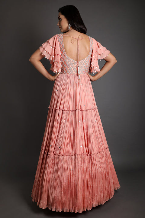 Peach ruffles embroidered rushed layered gown.