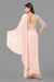Baby pink draped saree gown with embellishments.