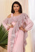 Baby pink crepe saree style jumpsuit with ruffles.