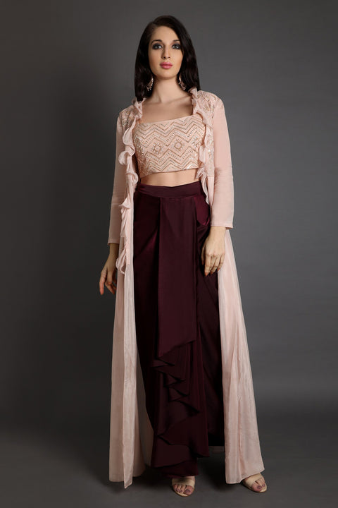 Wine draped skirt with ruffled jacket and crop top.