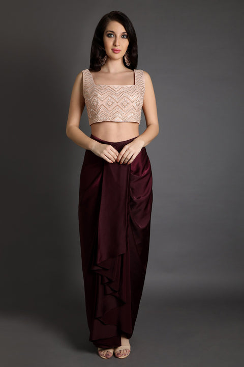 Wine draped skirt with ruffled jacket and crop top.