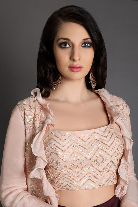 Wine draped skirt with ruffled jacket and crop top.