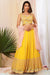 Mustard yellow flared skirt with matching crop top and contrast babypink dupatta.