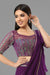 Purple embroidered crop top with layered flared skirt and draped ruffled dupatta in crepe fabric.