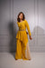 Mango yellow crepe and textured fabric jumpsuit.