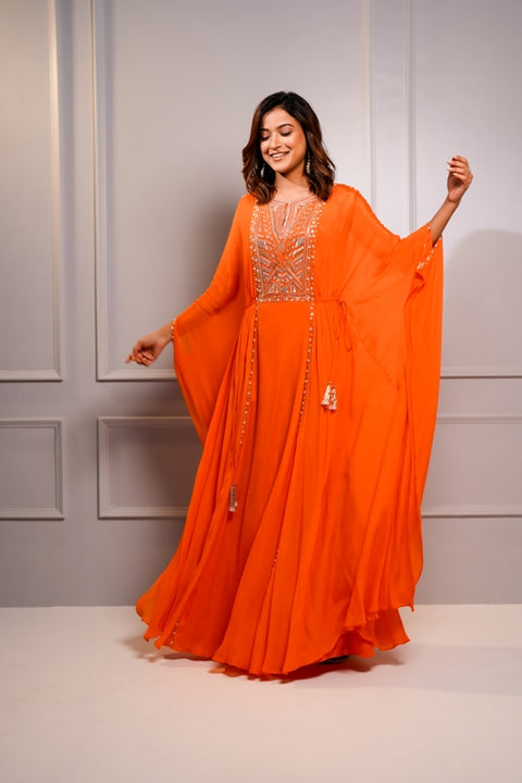Orange crepe kaftan style gown.
