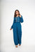 Teal Crepe Jumpsuit with atched overlap panel.